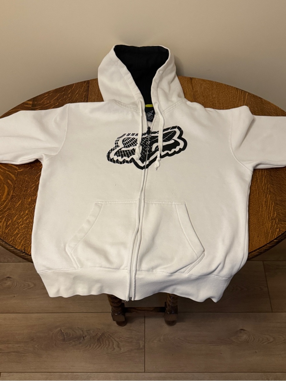 White Zip-Up Hoodie with Black Logo from the 90s